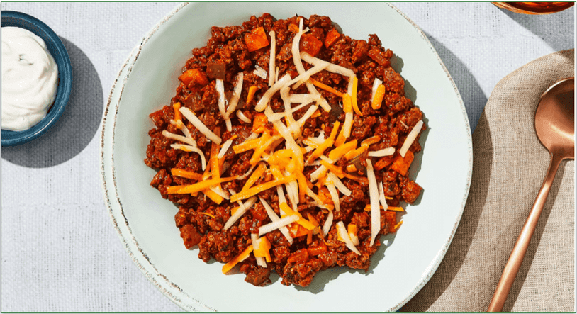 Factor's Chorizo Chili with Shredded Cheese & Scallion Sour Cream