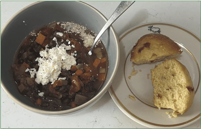 Diet-to-Go's Black Bean Chili from the Balance menu, served in a bowl with cornbread