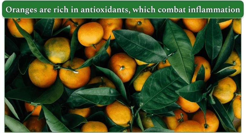 Dozens of oranges mixed with leaves