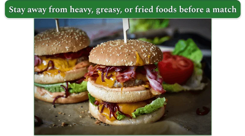 two burgers side-by-side beside some veggies