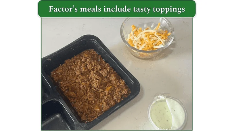 Factor’s Chorizo Chili alongside dishes of shredded cheese and sour cream