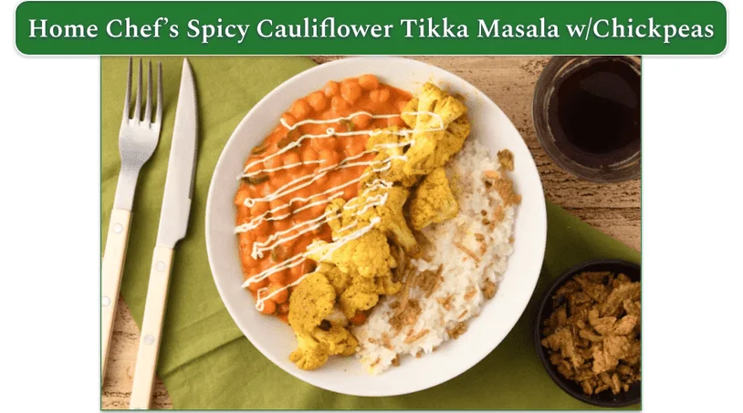 A plate of chickpeas, rice, and cauliflower tikka masala