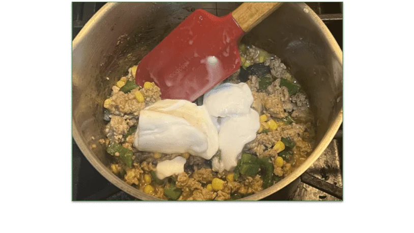 Photo of ingredients being stirred into a pot
