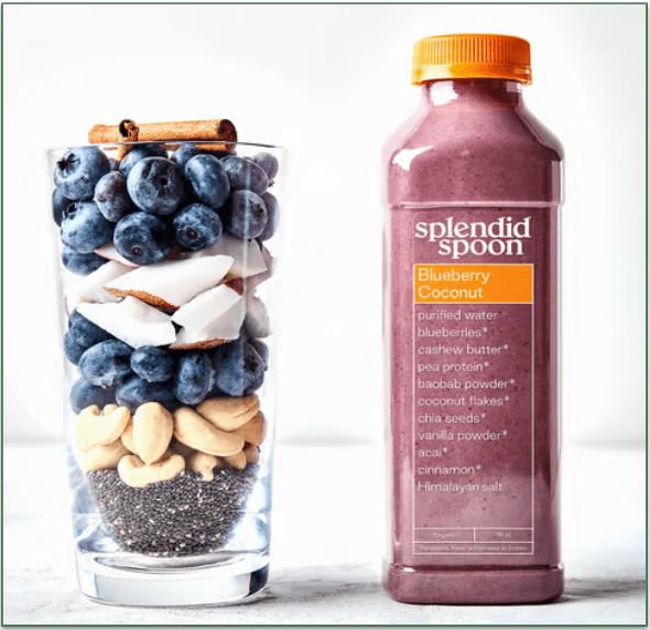 Image of a bottle of Splendid Spoon's Blueberry Coconut smoothie next to a glass full of all the ingredients used in the smoothie