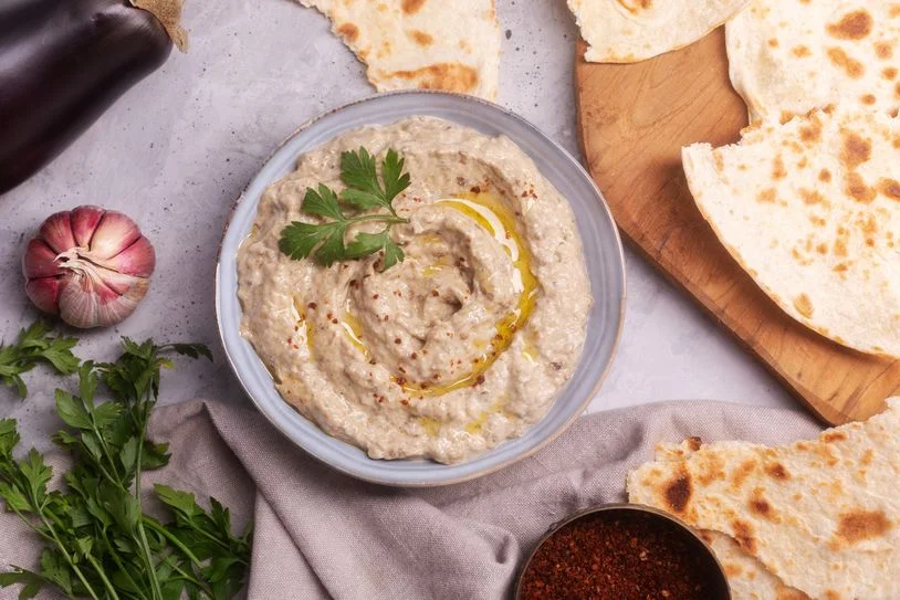 Baba ganoush on a plate with pita