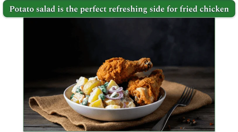 a plate of potato salad and fried chicken drumsticks