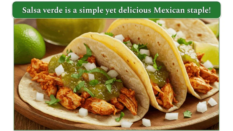 3 chicken tacos lined up on a wooden cutting board with salsa verde.