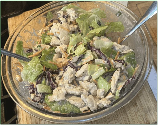 EveryPlate's Sweet Sesame-Lime Salad in a bowl with added chicken