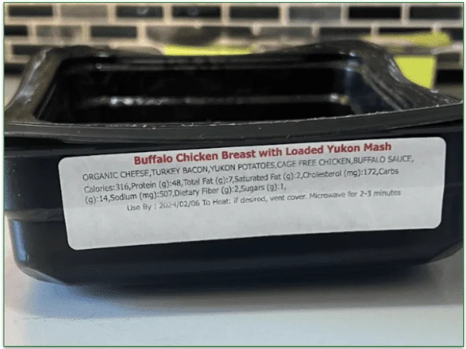 Photo of the ingredients and nutrition label on the microwaveable packaging stating "organic cheese" and "buffalo sauce" rather than each specific ingredient