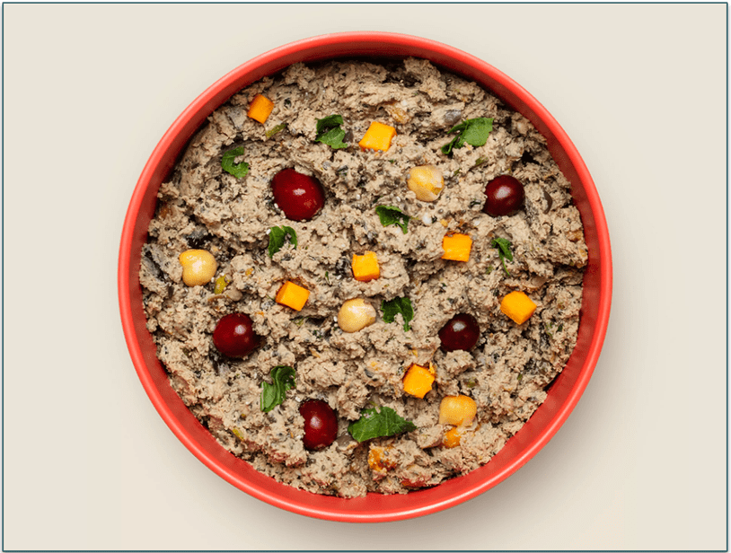 A bowl of Ollie Lamb Dish With Cranberries
