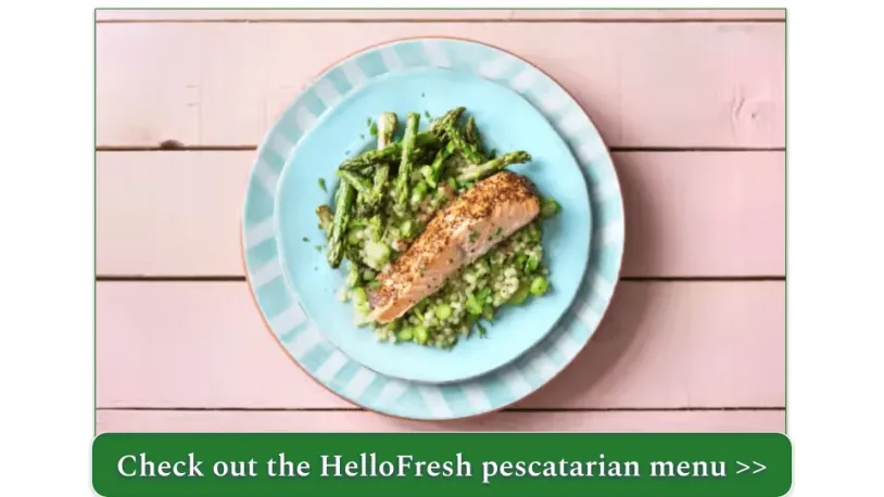 A plate of salmon with asparagus and Israeli couscous