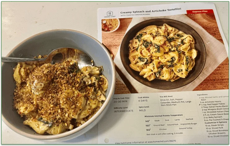 Bowl of Spinach and Artichoke Tortellini next to recipe card