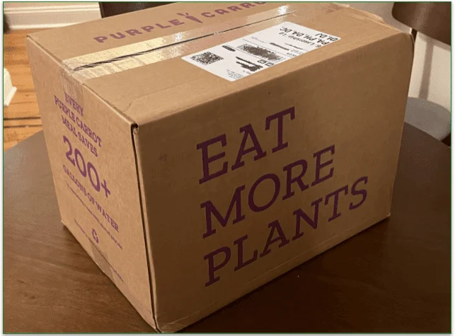 Photo of A Purple Carrot delivery box on a table