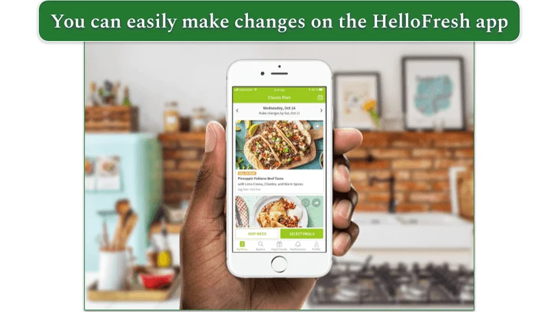 Image of a hand holding a phone displaying HelloFresh's app