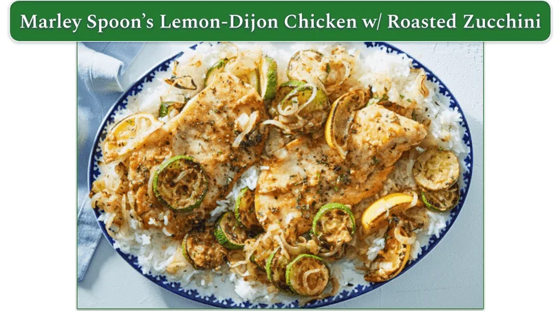 A plate of lemon dijon chicken with rice and roasted zucchini