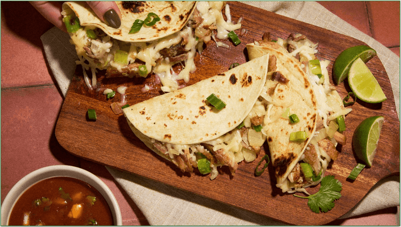 Photo of three tacos from EveryPlate served on a board