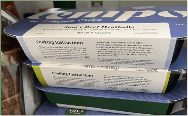 Photo of Tempo meals in a fridge showing the heating instructions on the side of packs