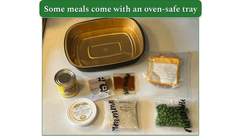 Dinnerly chicken tikka masala ingredients laid out with oven safe tray next to them