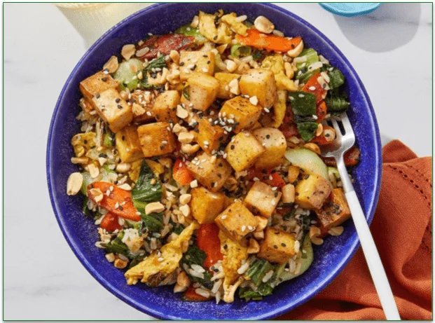 A plate of Yuzu & Maple-Glazed Tofu Over Fried Brown Rice from top meal delivery service, Blue Apron.