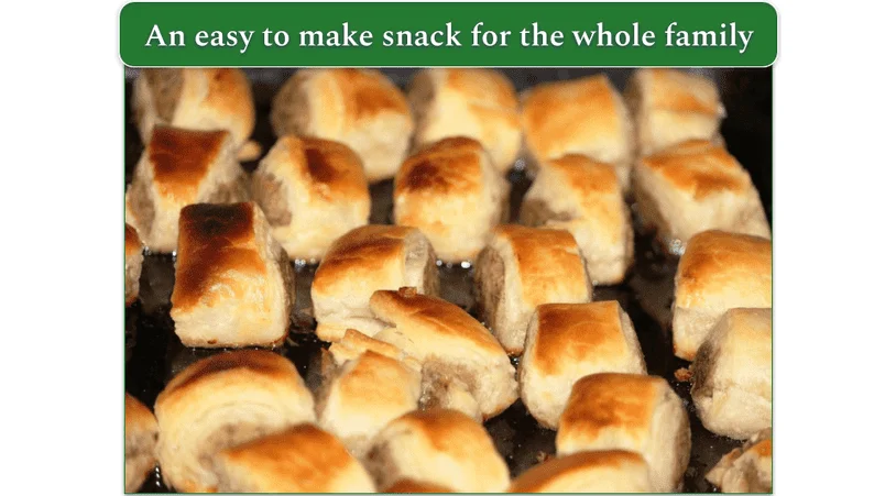A tray of Sausage Rolls in Puff Pastry baking in the oven