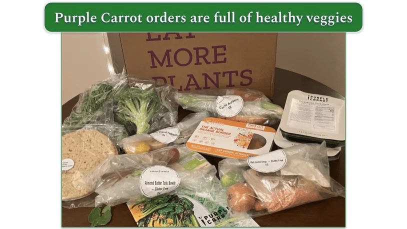 Photo of the contents of a Purple Carrot delivery box set out on a table