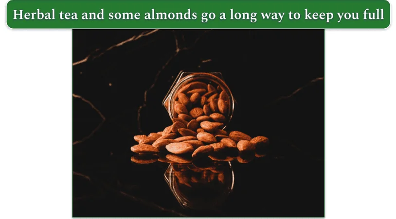 almonds spilling out of a jar on a glass table