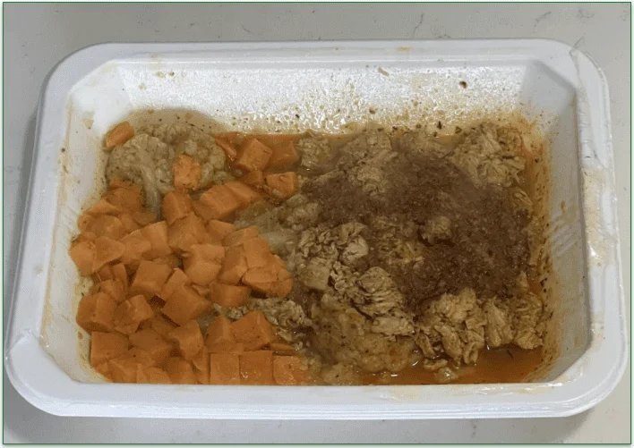 Photo of Trifecta's Peri Peri Inspired Chicken dish in a microwaveable tray