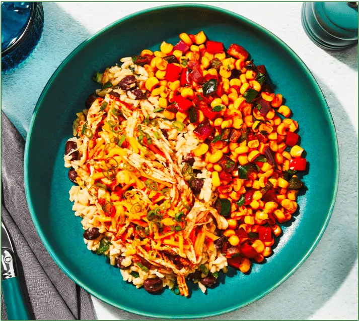 Factor's meal containing shredded chicken and corn succotash