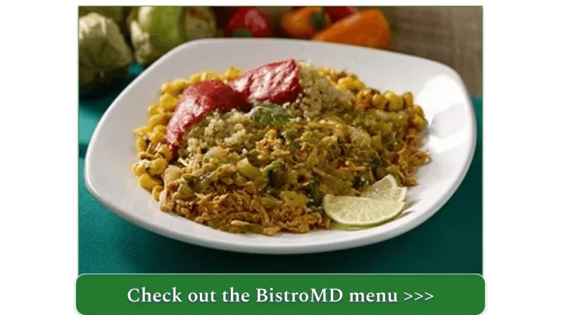 A plate of shredded smoked chipotle pork with salsa verde and corn