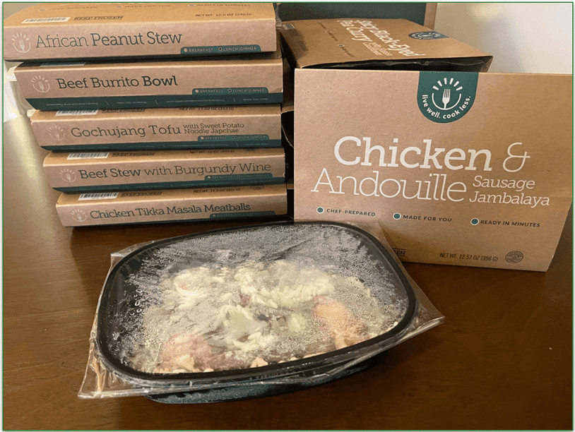 BistroMD meal boxes stacked up with a meal of Chicken Andouille at the front with plastic film still on