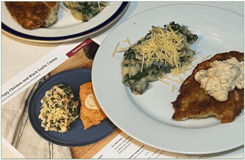 Home Chef’s Crispy chicken and black garlic crema plated next to the recipe card