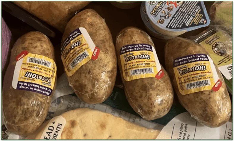 Potatoes individually wrapped in plastic packaging
