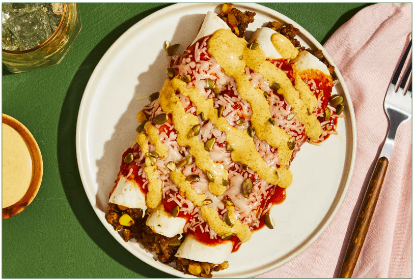 a screenshot of green chef's Beef Enchiladas corn, Southwest crema, toasted pepitas