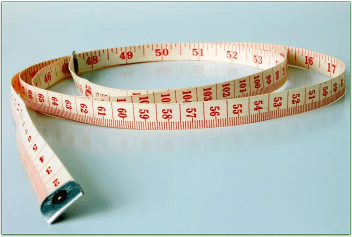 Image of a measuring ribbon, suggesting weight management