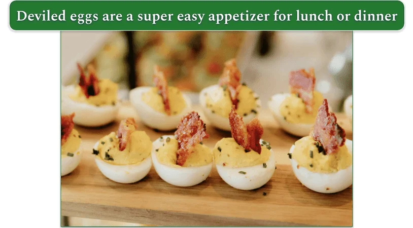 an array of deviled eggs on a wooden platter