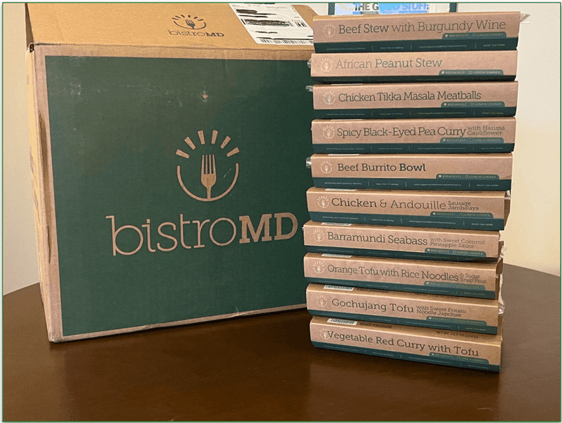 A stack of many BistroMD meals in their packaging