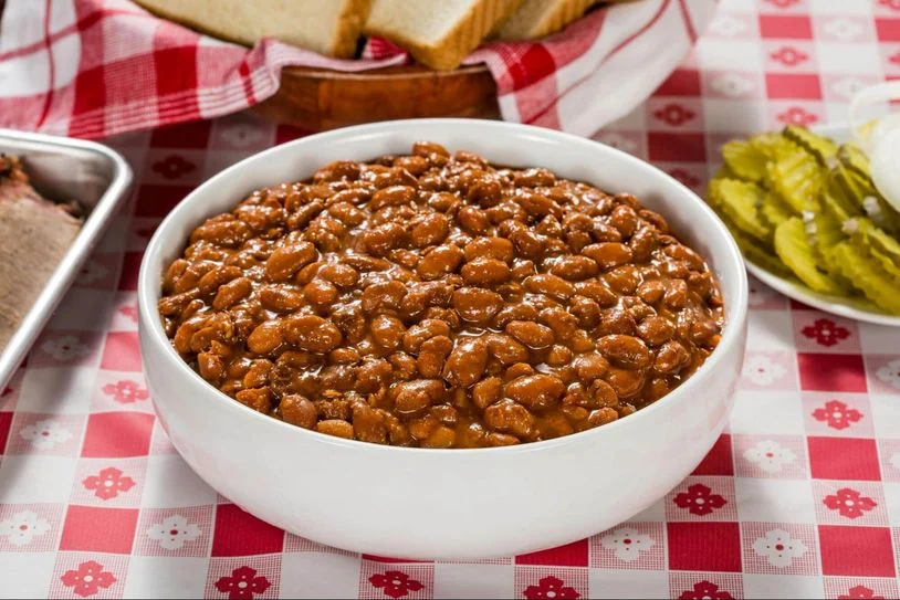 A bowl of baked beans, ready to enjoy