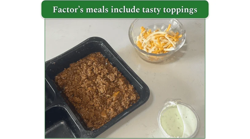 Factor’s Chorizo Chili alongside dishes of shredded cheese and sour cream