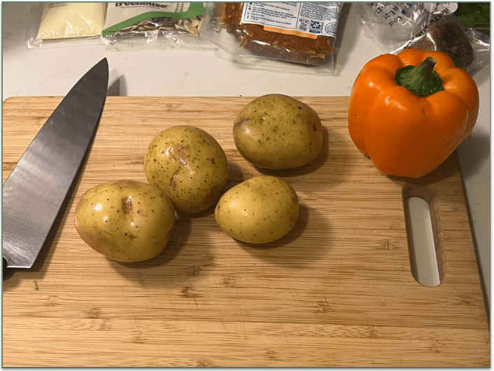 Whole produce from Blue Apron on a wooden chopping board