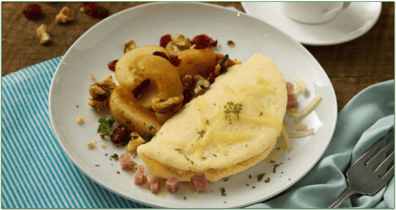 an omelet and stewed apples on a white plate