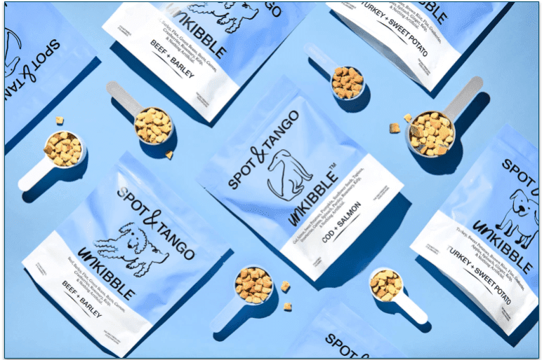 flat lay of unkibble packs on a blue background