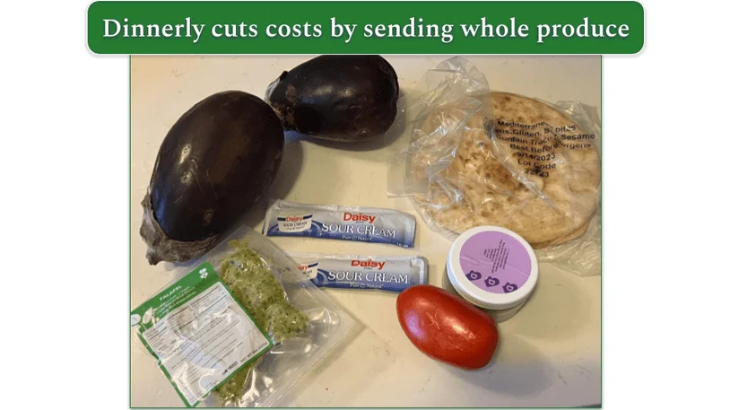 Whole vegetables on a wooden chopping board from a Dinnerly order
