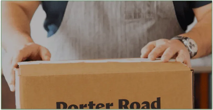 Man about to unpack a Porter Road delivery box