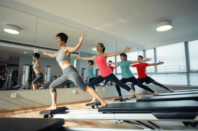 People doing pilates in an exercise studio