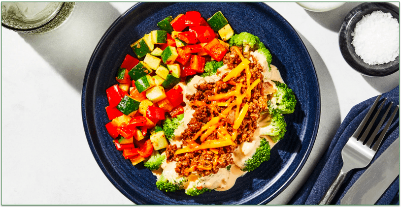 Factor's Broccoli Cheddar Ground Beef with Chili Garlic Zucchini & Red Bell Peppers