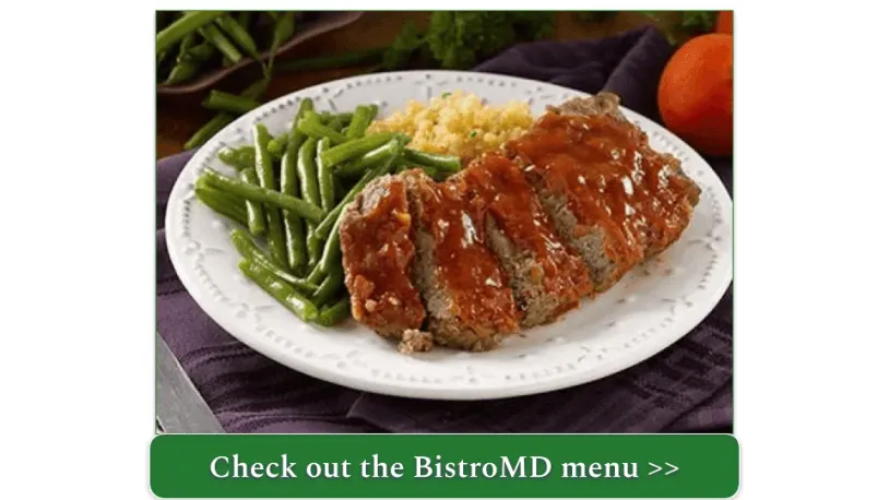 A plate of meatloaf with green beans