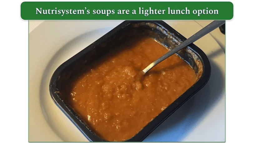 Photo of Nutrisystem's Creamy Tomato Soup in a microwaveable container with a spoon