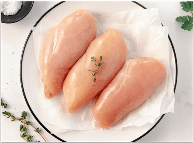 Seasoned chicken breasts on a plate