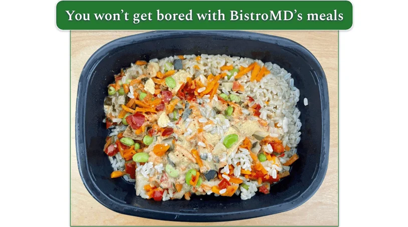 Vegetable red curry with tofu in microwave safe container