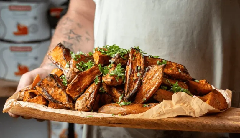 Baked sweet potatoes, on a wooden tray